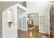 Grand foyer featuring hardwood floors, a high ceiling, and French doors leading to a home office at 505 Woodmoore Ct, Sandy Springs, GA 30342