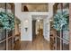 Elegant foyer with hardwood floors, high ceilings, and a view of the upper level at 505 Woodmoore Ct, Sandy Springs, GA 30342