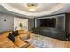 Stylish media room featuring a large TV, modern cabinets, and comfortable seating area at 505 Woodmoore Ct, Sandy Springs, GA 30342