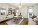 Bright office with custom built-ins, a modern desk, and hardwood floors at 505 Woodmoore Ct, Sandy Springs, GA 30342