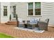 Cozy outdoor patio with comfortable wicker furniture and manicured landscaping at 505 Woodmoore Ct, Sandy Springs, GA 30342