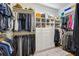 Well-organized walk-in closet with custom shelving and ample storage space at 505 Woodmoore Ct, Sandy Springs, GA 30342