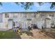 A spacious backyard features a patio, slide, and well-maintained lawn perfect for outdoor activities at 6962 Gallant Circle Southeast Se Cir # 24, Mableton, GA 30126