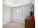 Bedroom featuring neutral walls, fan, window, and dark wood dresser at 6962 Gallant Circle Southeast Se Cir # 24, Mableton, GA 30126