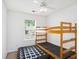 Spare bedroom featuring neutral walls, window, and a bunk bed with an air mattress at 6962 Gallant Circle Southeast Se Cir # 24, Mableton, GA 30126