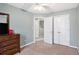 Bedroom featuring neutral walls, fan, closet, and dark wood dresser at 6962 Gallant Circle Southeast Se Cir # 24, Mableton, GA 30126