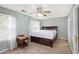 Bedroom featuring neutral walls, fan, and a bed in need of repair or replacement at 6962 Gallant Circle Southeast Se Cir # 24, Mableton, GA 30126