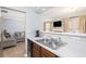 Open kitchen featuring a stainless steel sink and view into the adjacent living area at 6962 Gallant Circle Southeast Se Cir # 24, Mableton, GA 30126