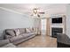 Comfortable living room featuring a fireplace, ceiling fan, and neutral decor at 6962 Gallant Circle Southeast Se Cir # 24, Mableton, GA 30126