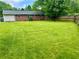Large backyard with a well maintained lawn and fenced perimeter at 1468 Spruce Se Dr, Smyrna, GA 30080