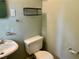 Modest bathroom with a toilet, sink, and modern decorations at 1468 Spruce Se Dr, Smyrna, GA 30080