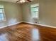 Bedroom featuring hardwood floors and natural light from a window at 1468 Spruce Se Dr, Smyrna, GA 30080