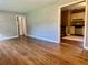 Bright living room with hardwood floors flowing into the kitchen at 1468 Spruce Se Dr, Smyrna, GA 30080
