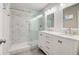 A modern bathroom features double sinks and a walk-in shower at 1101 White Oak Ave, Atlanta, GA 30310