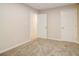 Bright bedroom with neutral walls and carpet at 1101 White Oak Ave, Atlanta, GA 30310