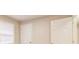 Bedroom features a window with blinds and two doors at 1101 White Oak Ave, Atlanta, GA 30310