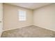 A minimalist bedroom shows neutral color scheme and carpet at 1101 White Oak Ave, Atlanta, GA 30310