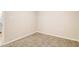 The bedroom features neutral carpeting, base trim, and a door for natural light at 1101 White Oak Ave, Atlanta, GA 30310