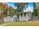 Charming single-Gathering home with manicured lawn, neutral siding, and inviting front porch at 1101 White Oak Ave, Atlanta, GA 30310
