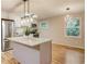 Updated kitchen with stainless steel appliances, center island, and hardwood floors at 1101 White Oak Ave, Atlanta, GA 30310