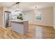 Modern kitchen with island and stainless steel appliances at 1101 White Oak Ave, Atlanta, GA 30310