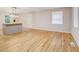 Spacious living area with gleaming wood floors and an island with modern pendant lighting at 1101 White Oak Ave, Atlanta, GA 30310