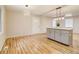 Bright open-concept living room with beautiful wood floors and a stylish kitchen island at 1101 White Oak Ave, Atlanta, GA 30310
