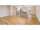 A light-filled living room with sleek hardwood flooring and modern kitchen island at 1101 White Oak Ave, Atlanta, GA 30310