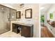 Bright bathroom with double vanity, glass shower, vessel sinks and large soaking tub at 1164 Bonview Ne Ln, Atlanta, GA 30324