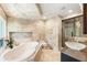 Spa-like bathroom featuring a soaking tub, marble accents, and walk-in shower at 1164 Bonview Ne Ln, Atlanta, GA 30324
