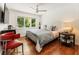Cozy bedroom with hardwood floors, large window, and bright natural light at 1164 Bonview Ne Ln, Atlanta, GA 30324