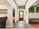 Bright entryway featuring stone floors, a frosted glass door, and clerestory windows at 1164 Bonview Ne Ln, Atlanta, GA 30324