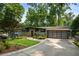 Beautiful home featuring stone accents, a modern garage door, and a professionally landscaped yard at 1164 Bonview Ne Ln, Atlanta, GA 30324