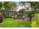Beautifully landscaped yard with a well maintained lawn and trees surrounding the property at 1164 Bonview Ne Ln, Atlanta, GA 30324