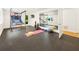 Bright gym featuring rubber flooring, a basketball game, a workout mirror, and a variety of exercise equipment at 1164 Bonview Ne Ln, Atlanta, GA 30324