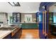 Well-appointed kitchen featuring a stone accent wall, modern appliances, and dual-toned cabinetry at 1164 Bonview Ne Ln, Atlanta, GA 30324