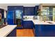 Stunning kitchen with glass-front refrigerator, custom cabinetry, and light countertops at 1164 Bonview Ne Ln, Atlanta, GA 30324