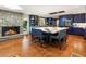 Gorgeous kitchen featuring a large waterfall island, stone fireplace, and blue cabinetry at 1164 Bonview Ne Ln, Atlanta, GA 30324