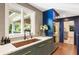 Modern kitchen features a copper sink, marble countertops, and stainless steel appliances at 1164 Bonview Ne Ln, Atlanta, GA 30324