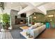 Relaxing outdoor living space with fireplace, comfortable seating, and beautiful vaulted ceilings at 1164 Bonview Ne Ln, Atlanta, GA 30324