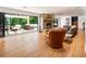 Beautiful living room with stone fireplace and sliding doors that lead to the spacious outdoor deck at 1164 Bonview Ne Ln, Atlanta, GA 30324