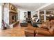 Spacious living room featuring a stone fireplace, wood floors, and comfortable seating arrangements at 1164 Bonview Ne Ln, Atlanta, GA 30324