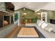 Inviting living room featuring a stone fireplace, comfortable seating, and bright natural light at 1164 Bonview Ne Ln, Atlanta, GA 30324
