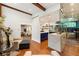 Open-concept living room with beamed ceilings and wine storage at 1164 Bonview Ne Ln, Atlanta, GA 30324
