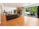 Bright living room with stone fireplace, hardwood floors, and glass doors to the outdoor patio at 1164 Bonview Ne Ln, Atlanta, GA 30324
