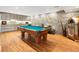 Finished basement features a pool table, kitchenette, jukebox, and a stone accent wall at 1164 Bonview Ne Ln, Atlanta, GA 30324