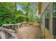Charming back porch, wood construction, a relaxing space to enjoy the outdoors and garden views at 1921 Flint Hill Dr, Lawrenceville, GA 30044