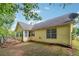 Charming backyard with fenced yard, deck, and lush greenery, perfect for outdoor enjoyment and privacy at 1921 Flint Hill Dr, Lawrenceville, GA 30044