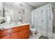 Neutral bathroom design features a wood vanity with white sink at 1921 Flint Hill Dr, Lawrenceville, GA 30044