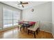 Dining room with hardwood floors, a large window and a modern dining room set for four at 1921 Flint Hill Dr, Lawrenceville, GA 30044
